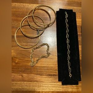 Assortment of gold colored costume jewelry bracelets